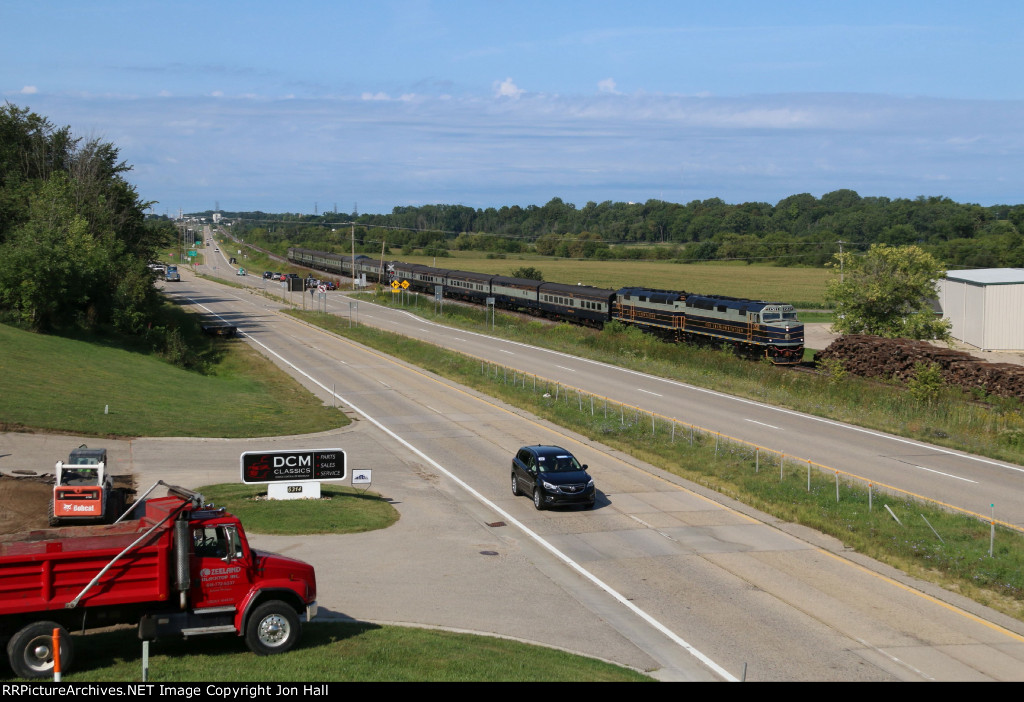 P001 rolls by with the consist in the new B&O inspired paint